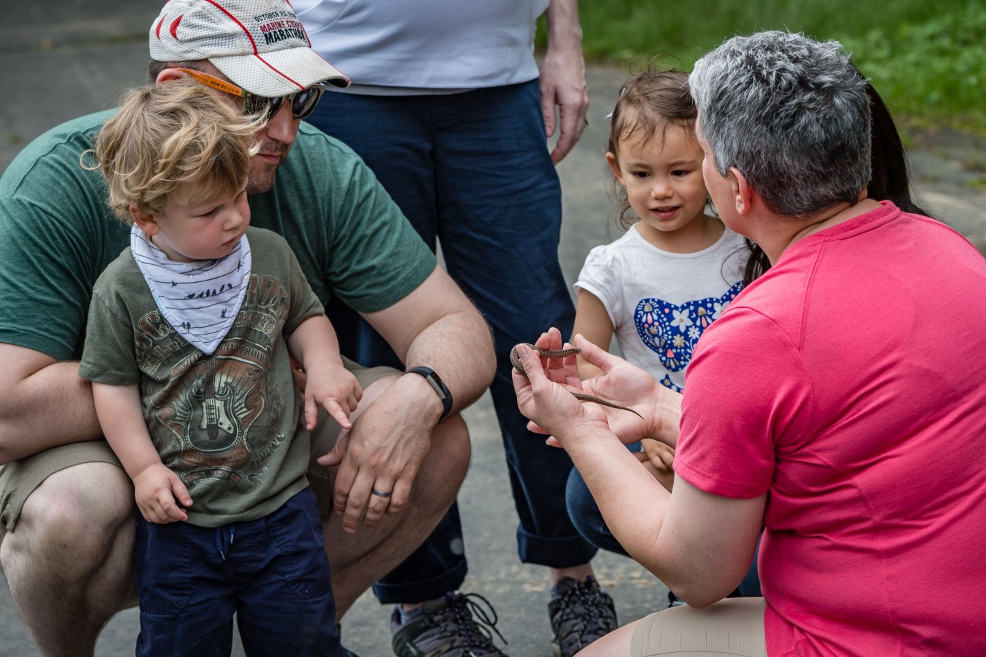 Group tour at Meadowlark Botanical Gardens, dad with two toddler children