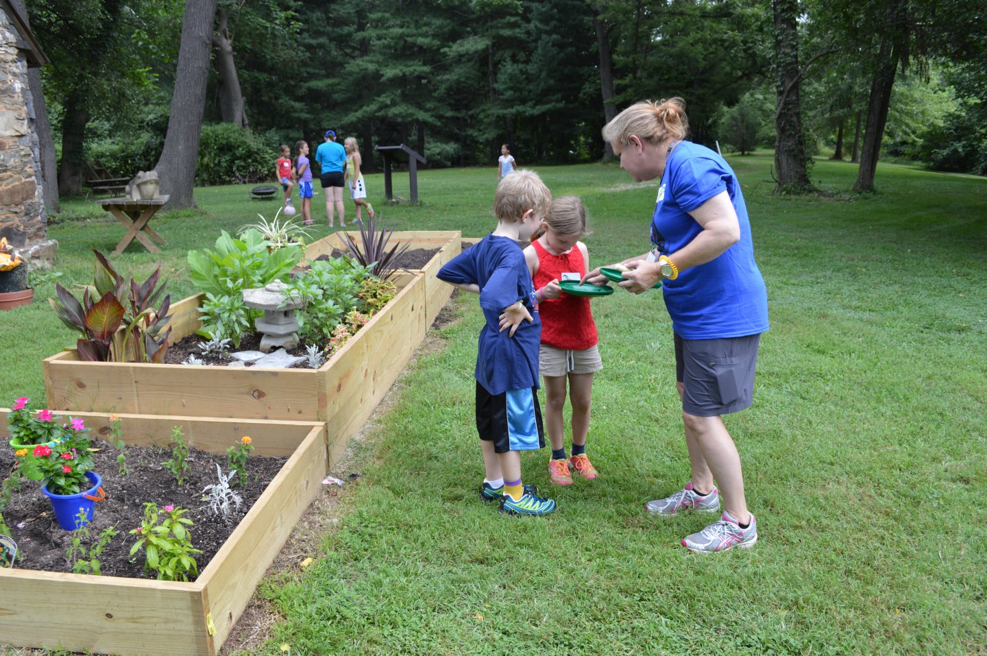 Camp counselor with two boys
