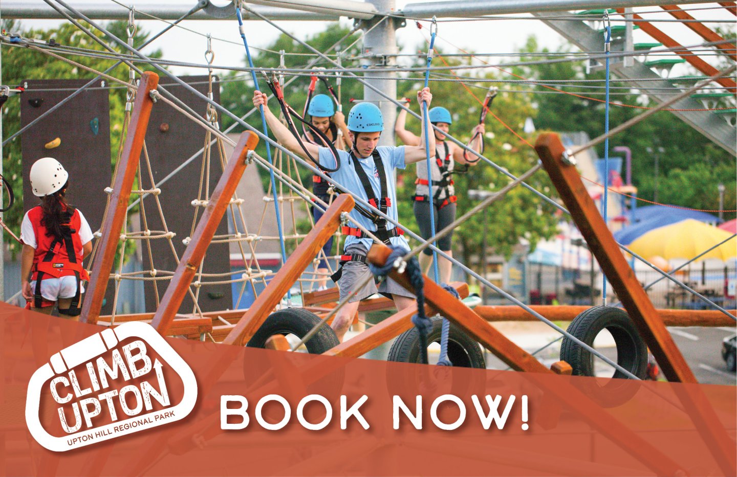 Four people climbing on Climb UPton. Climb UPton logo in bottom left corner Text overlay states Book Now
