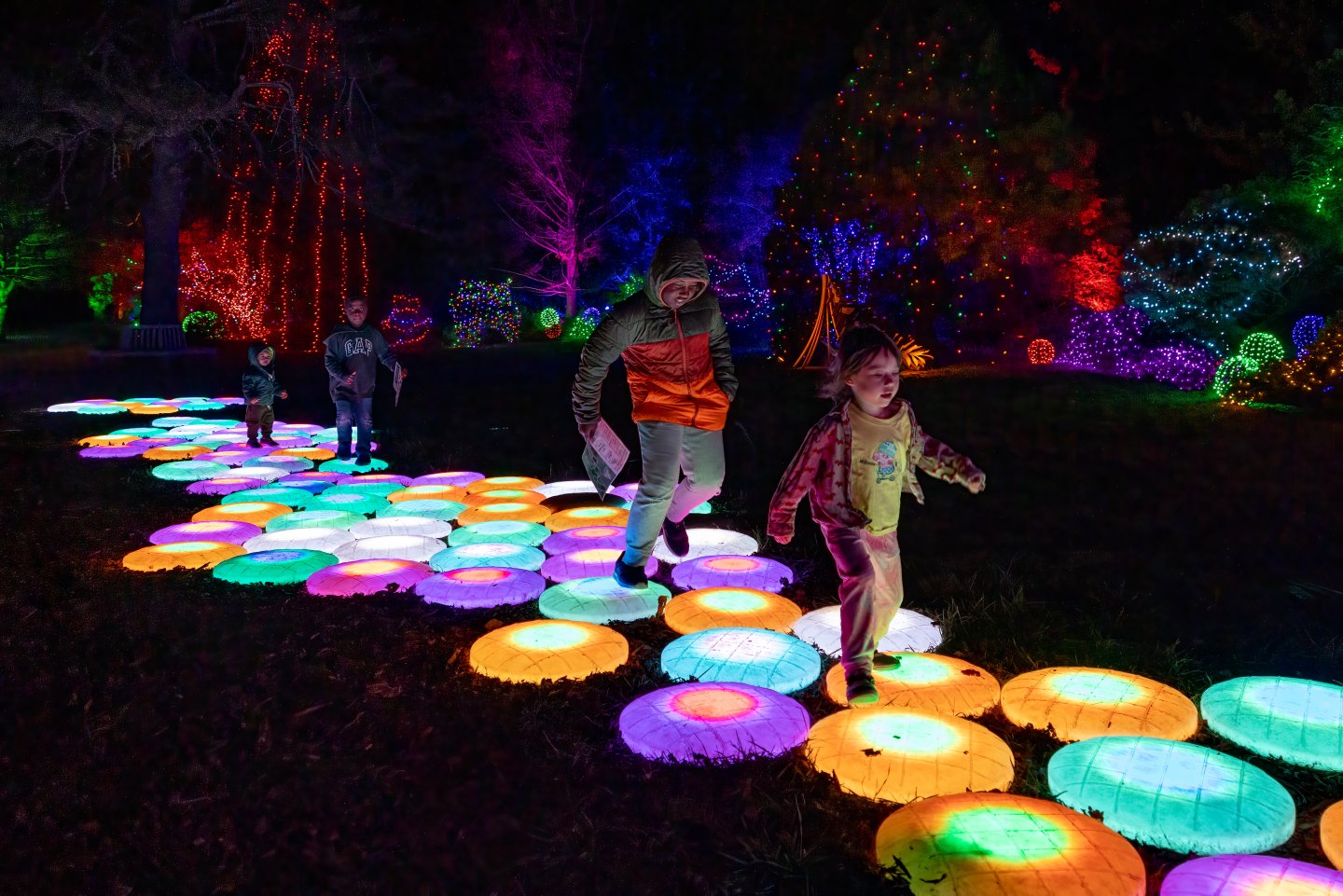 Children playing on stomp-a-toons light show activity