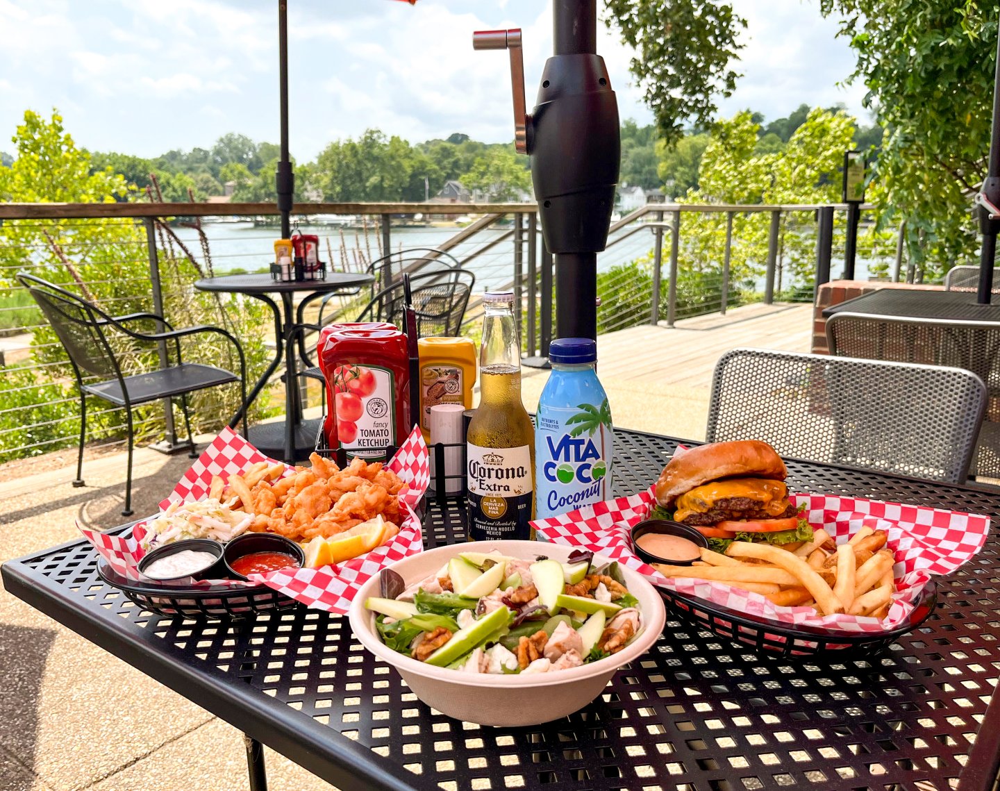 Burger, salad, fried shrimp platter and drinks on Brickmakers Cafe patio