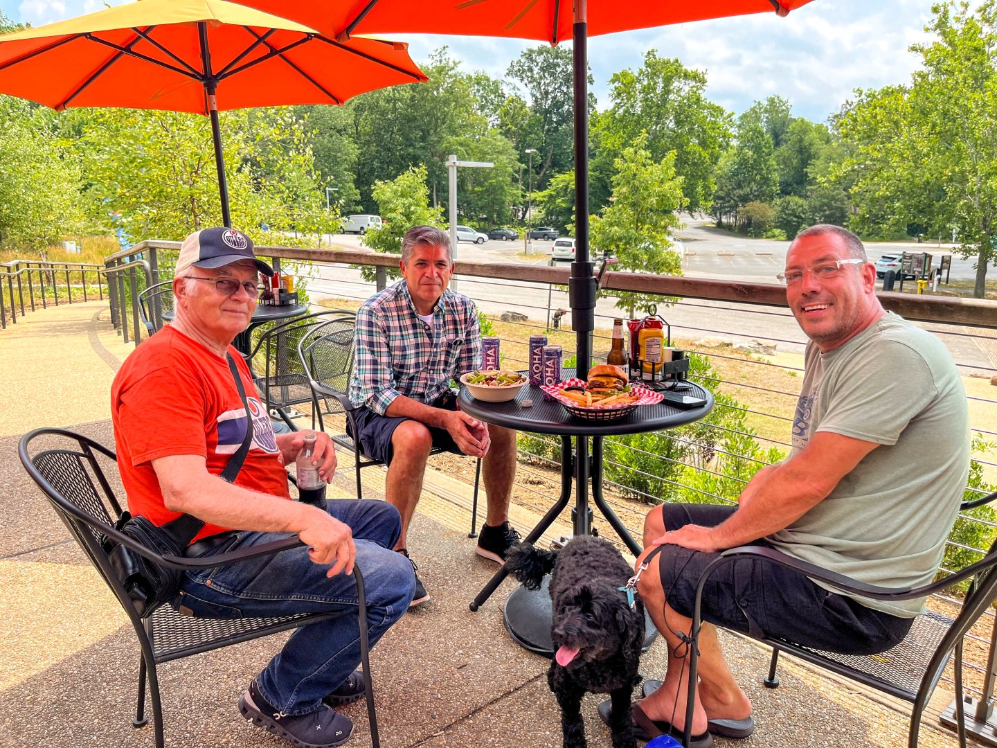 Smiling group on patio of Brickmakers Cafe