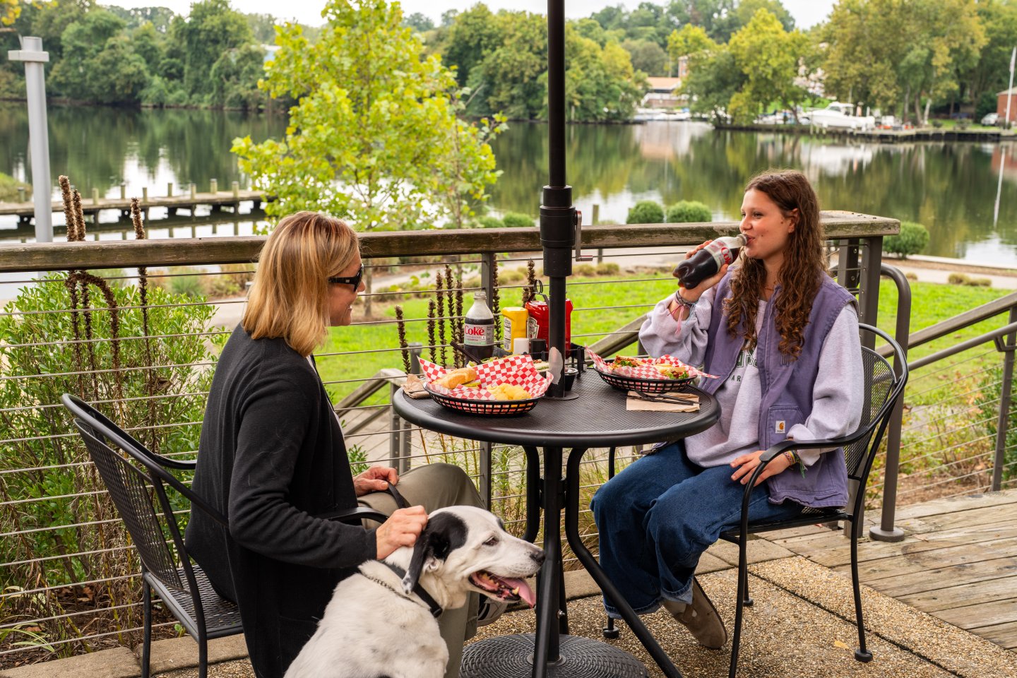 Mother and Daughter enjoying lunch on the Brickmakers Cafe patio during fall