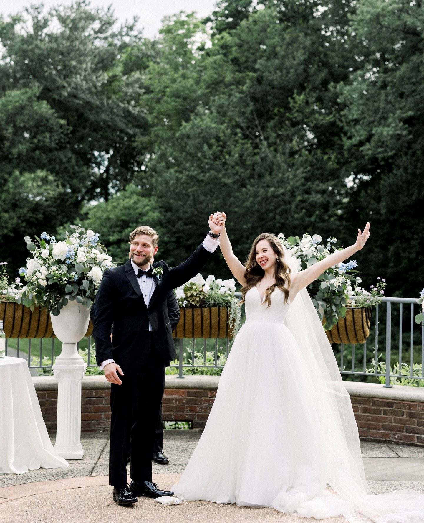 Newlyweds celebrating marriage on outdoor patio
