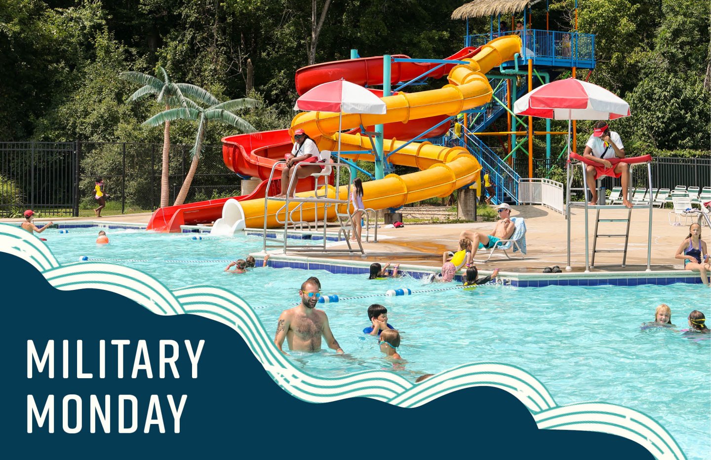 People swimming near colorful water slides and umbrellas.