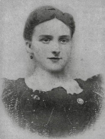 Sepia-toned portrait of a woman in Victorian clothing.