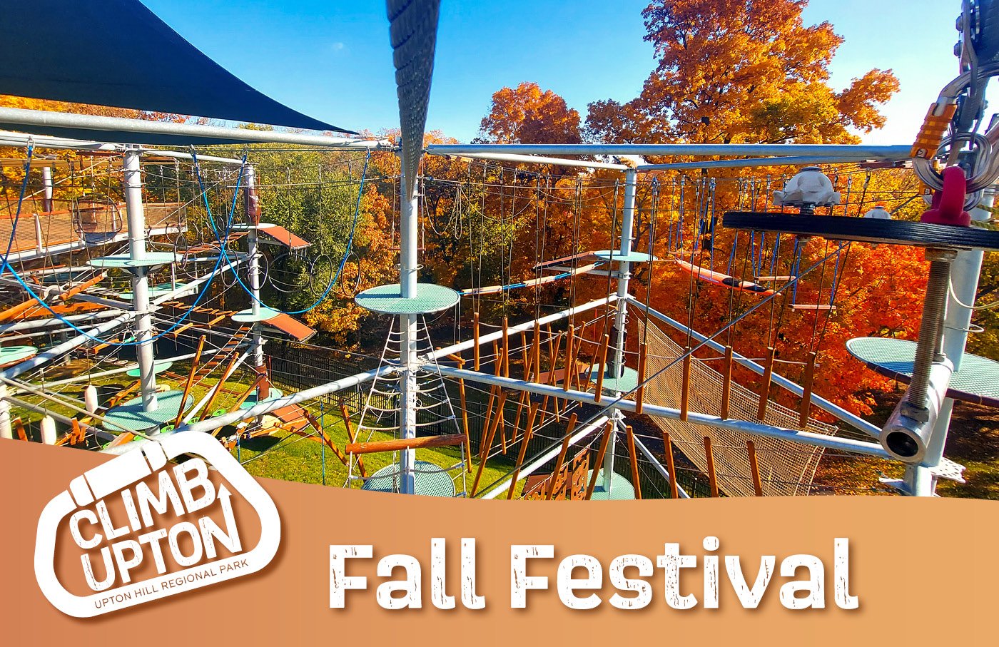 Fall ropes course with vibrant autumn trees in the background.