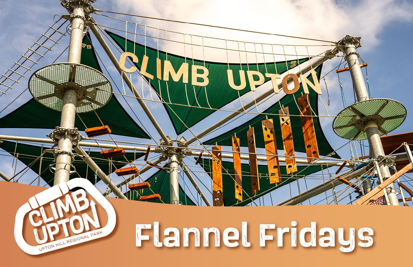 Rope course with green and orange banners, Climb Upton logo.