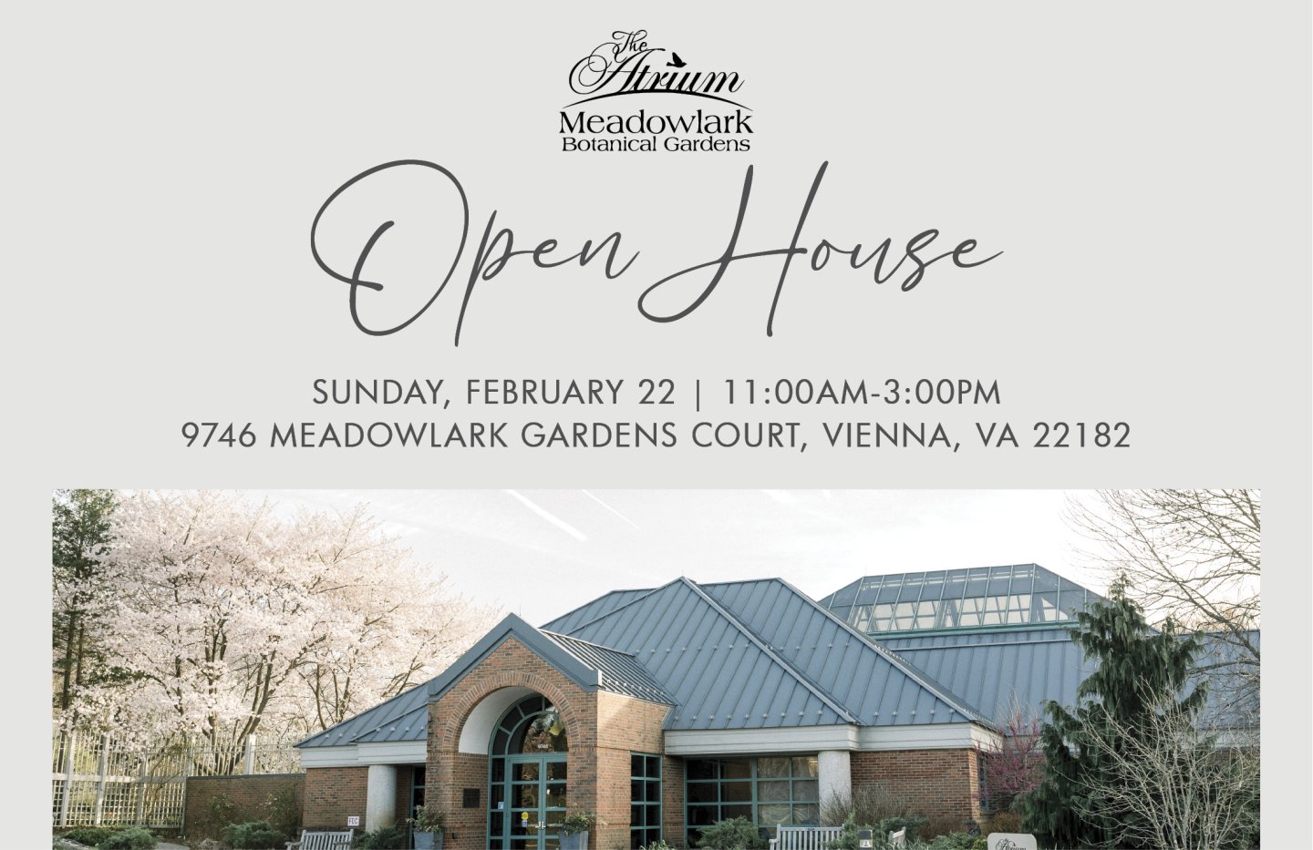 Open house sign with building, trees, and cloudy sky.