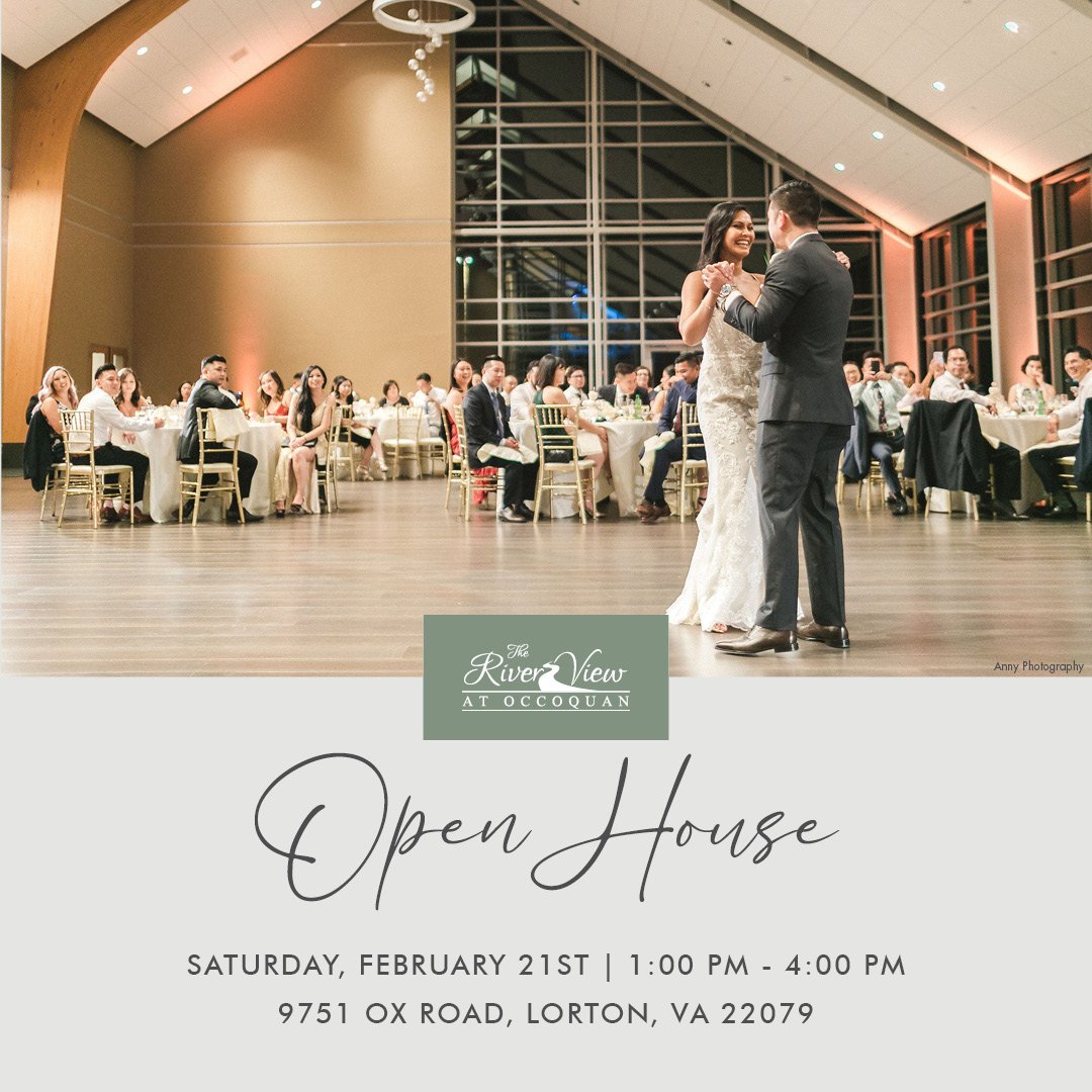 Couple dancing at an elegant event in a spacious hall.
