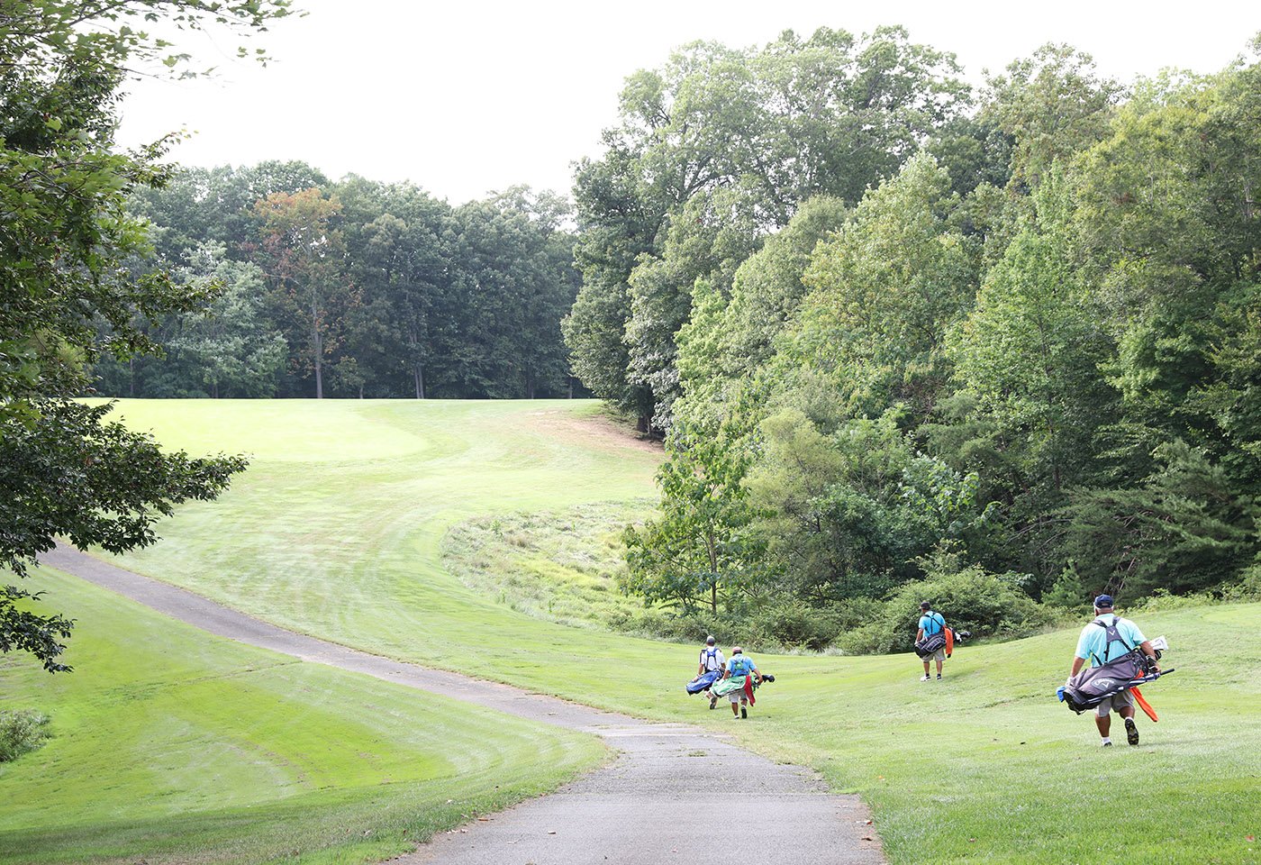 golf course with golfers walking