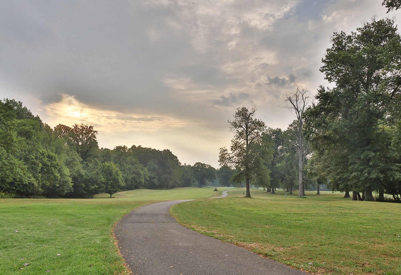 golf course with cloudy sky