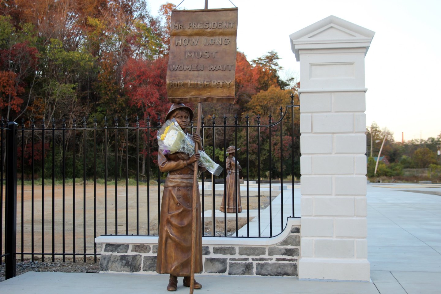 suffragist outside Turning Point Memorial