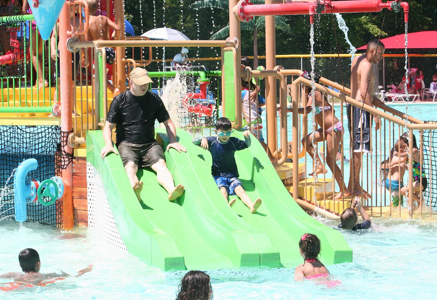 father and son on waterslide
