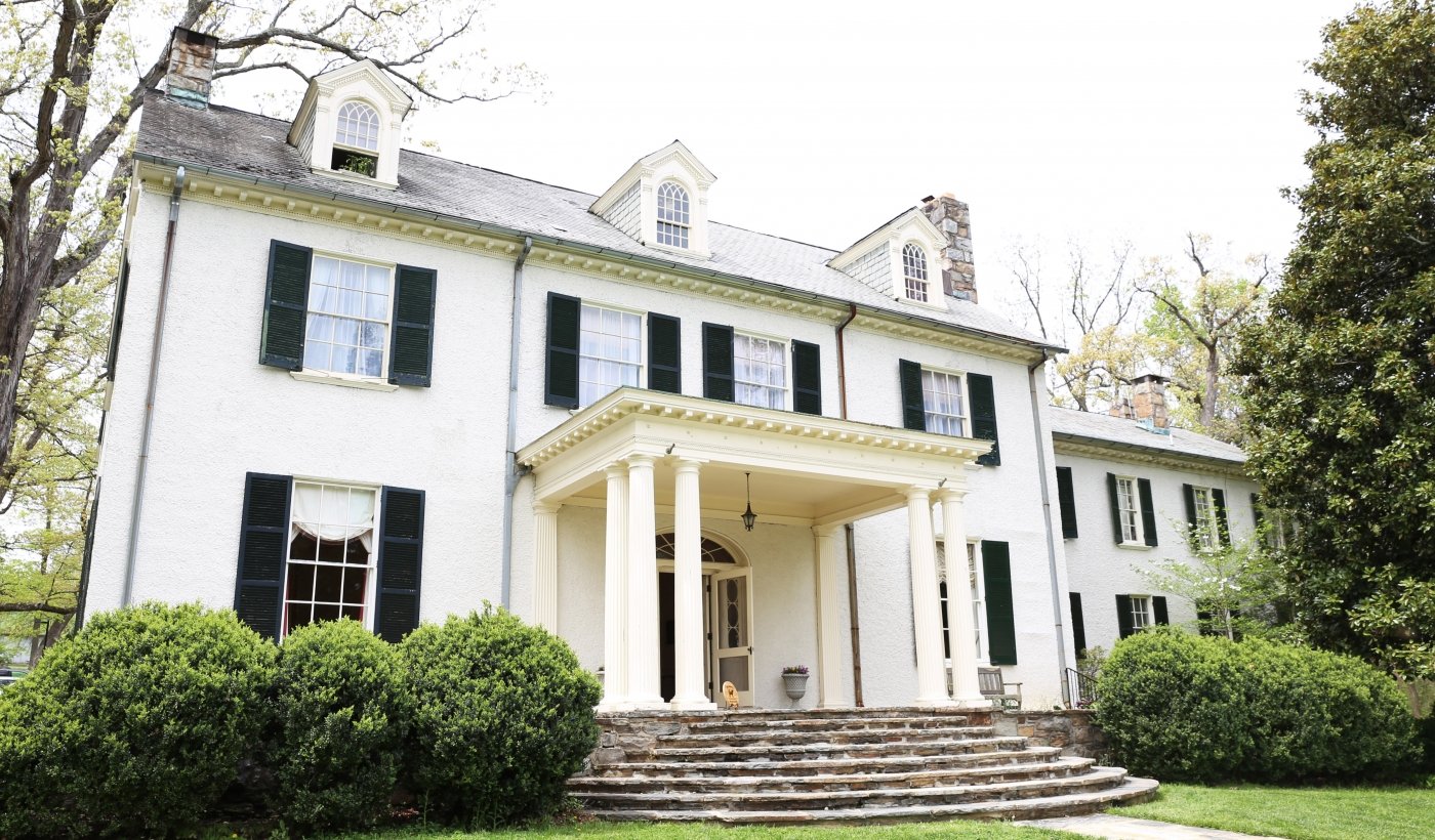 front of rust manor house